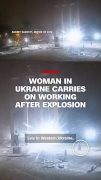 Woman in Ukraine carries on working after explosion