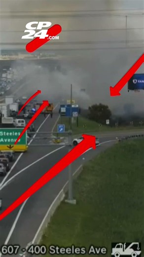 Large fire and plumes of smoke stalls traffic on northbound Highway 400