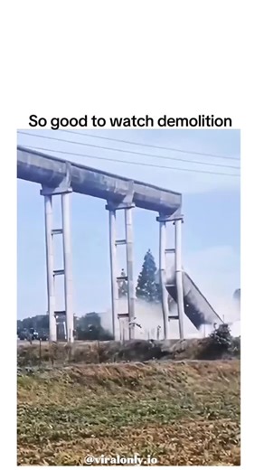 Entertainment on Instagram: "The post features a viral clip of the Black Hawk Bridge implosion in Lansing, Iowa, on 19 December 2025, where explosives trigger a seamless, domino-style collapse of the 100-year-old structure, amassing over 400,000 views in a day for its hypnotic precision. Built in 1927 to connect Iowa and Wisconsin across the Mississippi River, the bridge was closed in October 2025 due to structural deterioration and demolished to clear space for a new cable-stayed crossing slate