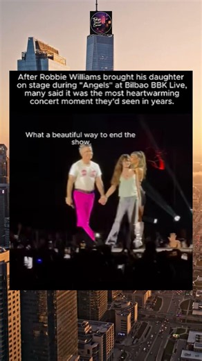 obbie williams bringing his daughter on stage during a performance of angels at bilbao bbk live