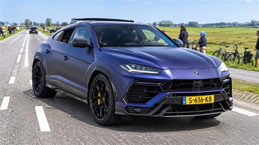 Lamborghini Urus accelerates along a country road