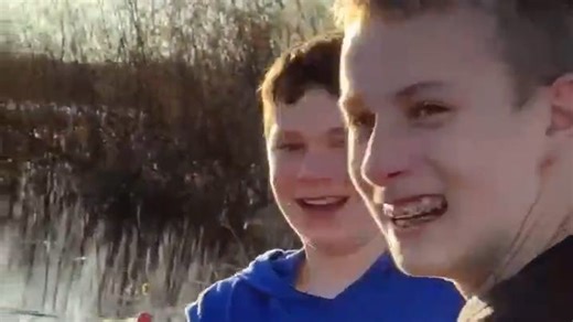 Petoskey teen catches big fish that was swimming across flooded road