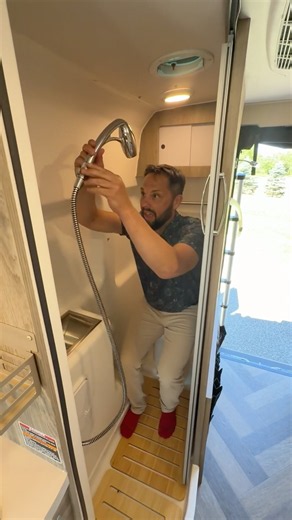 A van with a toilet and shower you could use at the same time!