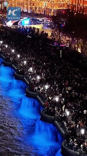 Tens of thousands pack Shanghai's iconic Bund on New Year's Eve