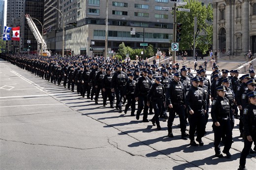 Montreal is crying: Slain police officer honoured with ceremony at Bell Centre, procession of thousands