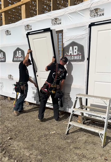 The AB Buildings guys getting all the @Durabuilt Windows & Doors doors installed on a bit of a windy day! The Durabuilt doors and windows are built here in AB and know how to handle our weather 👍