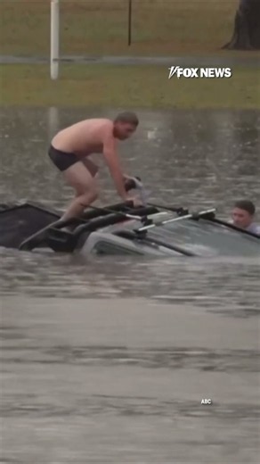 TV reporter dives into floodwaters to save driver in sinking car #shorts #foxnews #news #us
