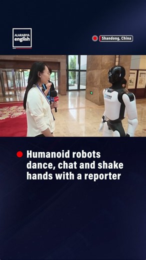 Robots Dance, Shake Hands at AI Base in China