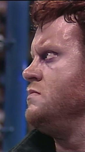 Undertaker rises from the casket and unleashes a menacing attack on Ultimate Warrior