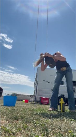 Woman's Ponytail Gets Stuck on Overhead Electric Wire