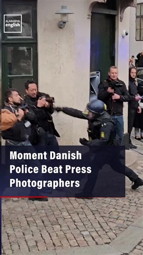 Eyewitness footage shows Danish police striking press photographers with batons during demonstrations in Copenhagen, prompting backlash over press freedom.