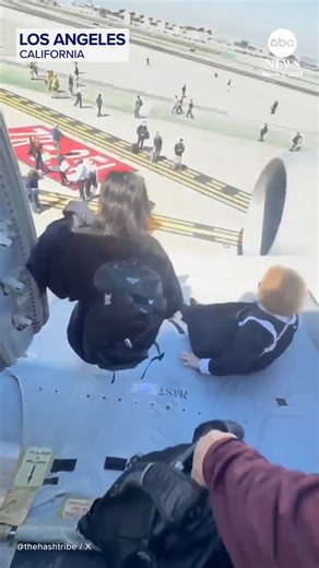 Passengers aboard a Boeing 787 Dreamliner were forced to evacuate by slides after the United Airlines flight landed at Los Angeles International Airport with its left engine in flames. https://abcnews.visitlink.me/P2wtGt | ABC News