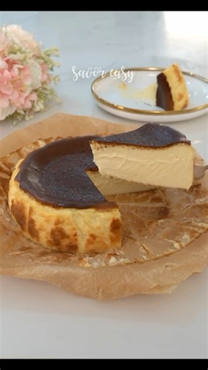 The Iconic BASQUE Cheesecake How to make this iconic Basque Cheesecake that is so impossible to mess up. Here's what you'll need: 500 grams cream cheese softened 3/4 cup sugar(150g) 1/2 tsp salt (3g) 3 large eggs 1 tsp vanilla extract (5ml) 1 and ¼ cup heavy cream (300ml) 3 tbsp cornstarch (15g) 1. Preheat oven at 240℃ or 450℉. 2. Scrunch two precut parchment paper. Spray oil on a 7x3 inches spring form pan and place the parchment papers. Set aside for later. 3. In a bowl, beat softened cream un