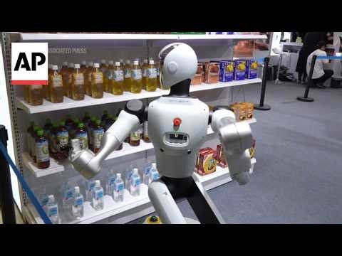 Robots crack jokes and grab items at Humanoid Robot Expo in Tokyo