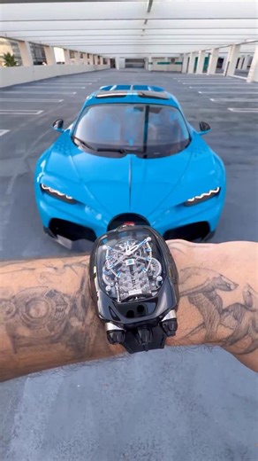 The Bugatti Chiron Tourbillon is a groundbreaking tribute to the hypercar legend, featuring a 578-component movement and a W16 engine block automaton. Experience the thrill of high performance on your wrist with every mesmerizing detail. 55 x 44-mm black titanium case W16 engine block automaton 30°-inclined flying tourbillon Fuel gauge-shaped power reserve #JacobAndCo #Inspiredbytheimpossible #bugatti | Jacob & Co.