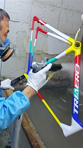 Multi-color frame painting step 17:Applying a final coat of clear varnish to the T47 frame.