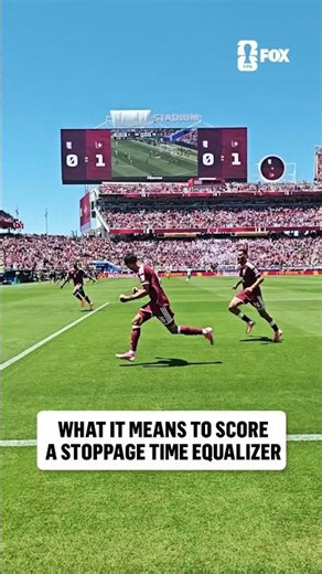 Pitchside angle of Qatar securing its first-ever FIFA World Cup point