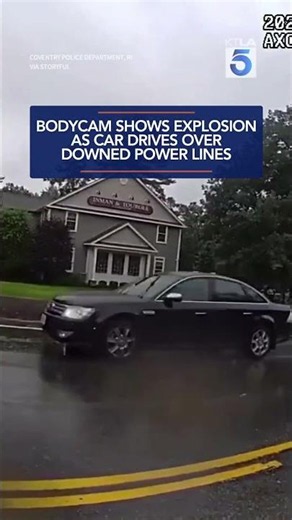 Bodycam shows explosion as car drives over downed power lines