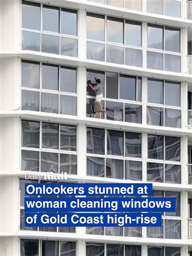The witness who shot the video later said they were 'too shocked' to film how high she was, but assured commenters they called triple-0 to inform them of the situation. The woman did not appear to be wearing a safety harness, despite the massive drop below her. Hundreds of commenters were horrified by the short clip, with one musing that she 'must be unwell' while another pointed out that 'if you don't fall, it should be fine'. The Australian Building Code requires fall prevention devices for op