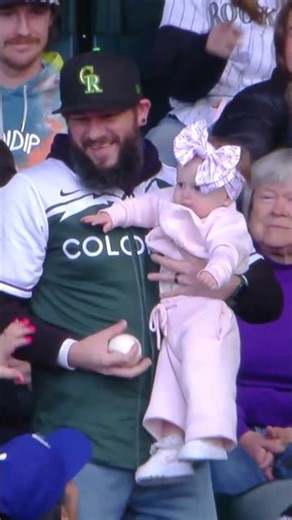 Fan catch of the year?! This guy caught a foul ball while holding a baby 🤯