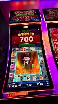 Winning at Monopoly Big Board Bucks Slot Game with 5 free spins left and full screen