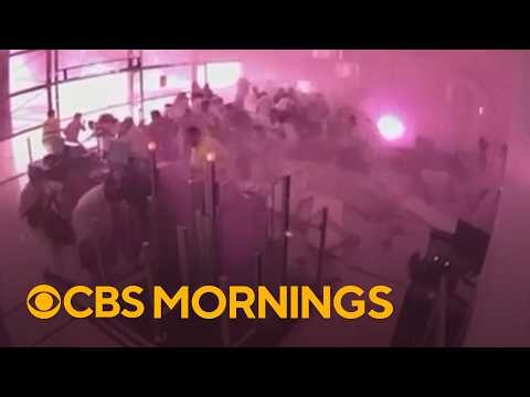 At least 12 dead, including an American, after deadly strikes on Saudi airport, officials say