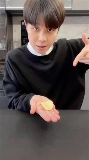 Exploding potato chips with finger