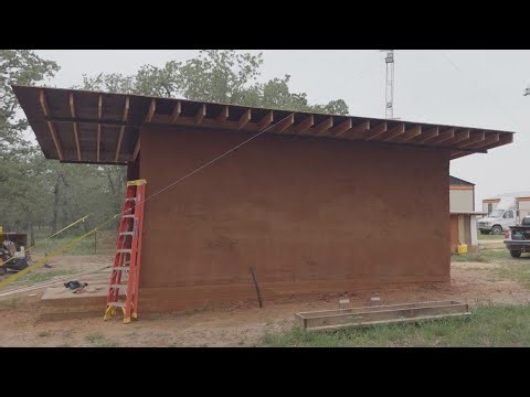 Robots are building clay homes in Central Texas using dirt from the ground