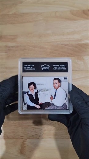 The Betty and Barney Hill: The First Alien Abductees Trading Card by SAUCER features a digitally remastered and colorized image of the couple whose 1961 UFO encounter became the first widely reported alien abduction in history. Their extraordinary experience not only impacted the growing field of UFO research but also left a lasting imprint on public perception of extraterrestrial life. Each SAUCER Trading Card is encapsulated in a hard plastic tamper-evident case designed for display. Each coll