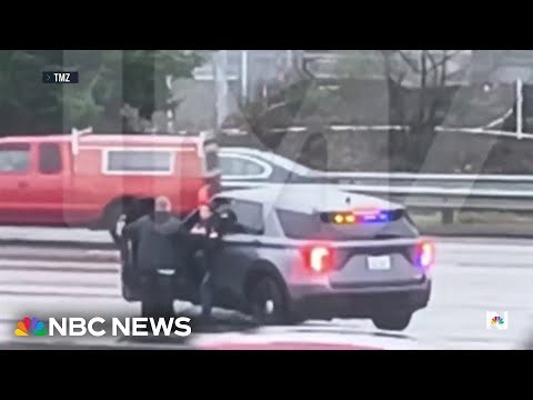 Police in Washington say suspect dragged lieutenant, stole car before chase