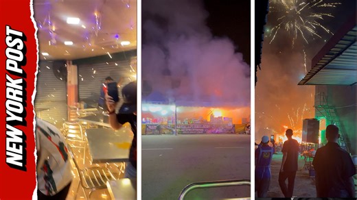 Horrifying moment explosion in fireworks stall causes chaos in nearby restaurant