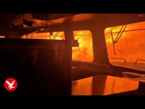 Terrifying footage shows train engulfed by wildfire in Canada