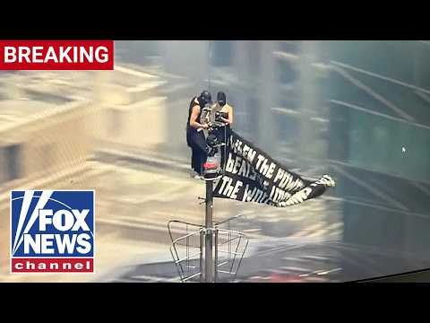 BREAKING: Protesters CLIMB Empire State Building spire