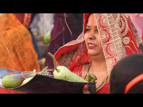 Chhath Puja Celebration on Yamuna River Banks in New Delhi with Devotees in Water