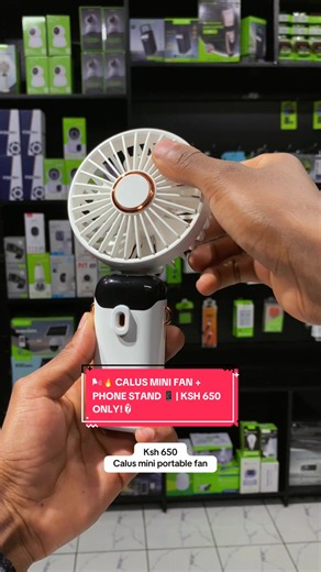 🌬️ Calus Mini Portable Fan — Ksh 650! 🔥 ✅ Portable & easy to carry ✅ Supports your phone 📱 ✅ Works as a phone stand ✅ Stay cool anywhere! 📩 DM to order today! #CalusAccessories #MiniFan #PhoneStand #GadgetsKenya #TikTokKenya