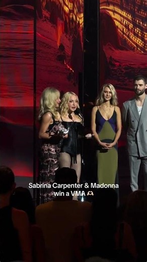 Sabrina Carpenter and Madonna accept the award for 'Best Collaboration' at the 2026 VMAs