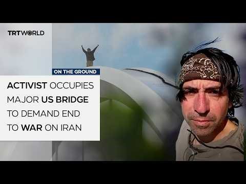 Activist sleeps atop major US bridge to demand end to war on Iran