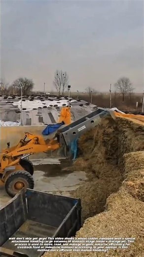Heavy Equipment Handling Biomass Silage in Large-Scale Storage Area.