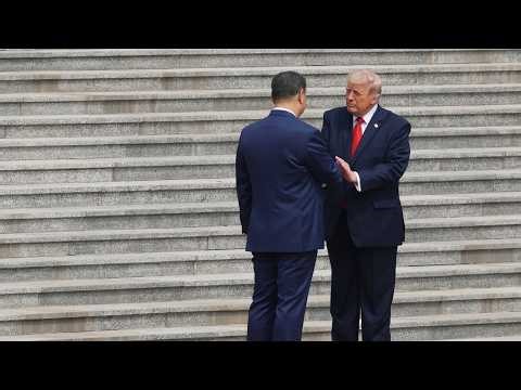 Trump shakes hands with Xi at start of historic U.S.-China summit