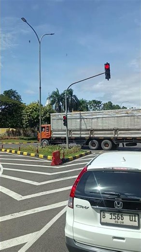 Midday Traffic at the Red Light with Flyover View