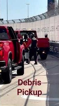 Crews clean up a crash on the Arlington Grand Prix course