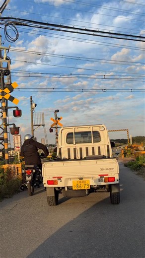 Train in Japan flying past a Kei truck and Honda Hunter Cub motorbike. Three different types of machines. All amazing in their own way | Mighty Car Mods