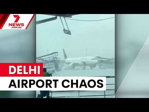 Staircase crashes into planes at Delhi airport | 7NEWS