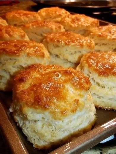 Bisquick, sour cream, 7-up and butter!.... These are excellent!!!! So easy and soooo good! Recipe is hard to find so here it is: 7 Up Biscuits 4 cups Bisquick 1 cup sour cream 1 cup 7-up 1/2 cup melted butter Mix bisquick, sour cream and 7 up. Dough will be very soft - don't worry Knead and fold dough until coated with your baking mix. Pat dough out and cut biscuits using a round biscuit / cookie cutter. Melt butter in bottom of cookie sheet pan or 9x13 casserole dish. Place biscuits on top of m