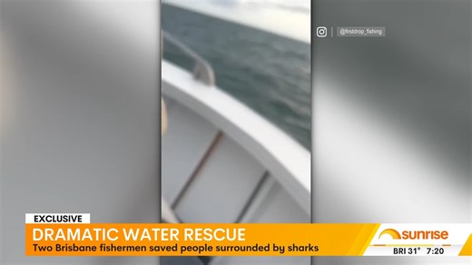 Two fishermen, Sam Hortz and Robbie Angel, rescued three men from capsized boats in Brisbane's Moreton Bay after spotting them surrounded by bull sharks. The rescuers pulled the men to safety within minutes, noting the increasing presence of bull sharks in the area that now frequently jump out of the water around fishing spots. The rescued men, though shaken, reached out to thank their rescuers. | Sunrise