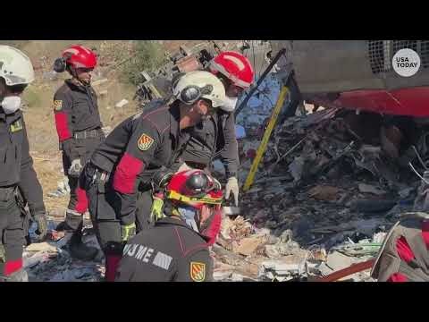 Spain train crash aftermath footage shows derailment of high-speed train cars and emergency response