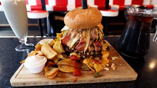 Woman attempts ridiculously big nacho cheeseburger challenge