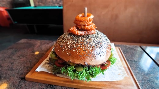 Girl tries mega 2.5kg burger challenge that hundreds have failed