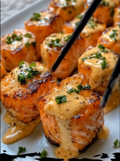 🐟 CRISPY BANG BANG SALMON BITES 🔥 Golden, crunchy salmon bites coated in a rich, creamy Bang Bang sauce with the perfect balance of sweetness and heat! ✨🐟 Crispy on the outside, tender and juicy on the inside, these delicious bites make a quick weeknight dinner or a crowd-pleasing appetizer. 🛒 INGREDIENTS 1 lb salmon fillet, sliced into bite-sized cubes ½ cup panko breadcrumbs 1 tsp paprika ½ tsp garlic powder 1 large egg Salt and black pepper, to taste 🌶️ FOR THE BANG BANG SAUCE ½ cup mayo