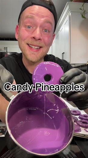 Easy #candyrecipe for Candy Pineapples 😁 #candy #pineapple #candypineapples #candyfruit Candy Pineapples Sliced Pineapples (canned works better) 2 C. Sugar 1/4 C. Corn Syrup 1/2 C. Water 1 drum of Flavor (I used grape) White food coloring (optional but preferred) Food coloring of choice (I used purple) Crushed hard candy (optional) Drain and dry pineapple slices very well, place them on a baking sheet and freeze til you're ready to dip. In a saucepan add the sugar, corn syrup, ano water bring t
